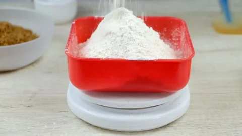 The cook weighs the flour  Stock Footage 232964666