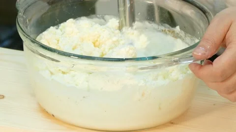 The cook whip the milk with a blender. Stock Footage 88501600