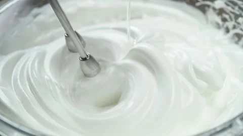 The cook whips the egg mixture and add the sugar syrup llittle by little. 스톡 동영상 202072405