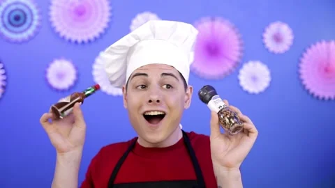 The cook in a white cap shows hot peppers for the dish Stock Footage 160506780
