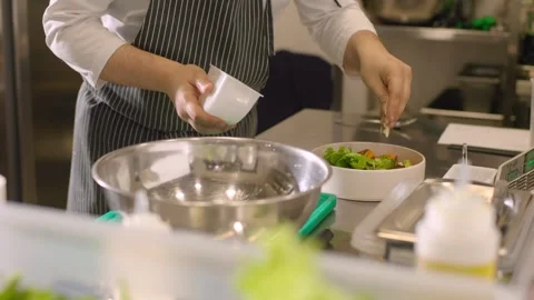 The cook is working. The process of preparing a bowl of fresh vegetables. Stock Footage 277131832