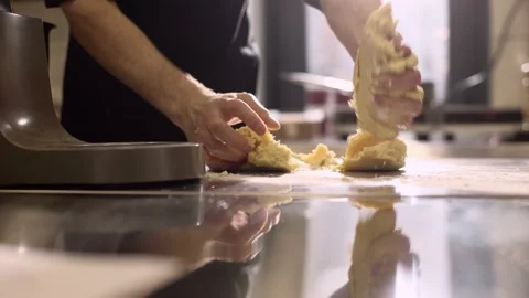 The cook works with an induction hob. The process of frying or stewing close-up. Stock-Footage 233296891