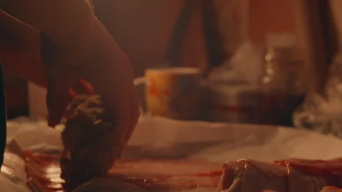 Cook wraps bacon rolls Stock Footage 117940809