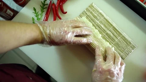 Cook wraps the sushi roll Video stock 106389227