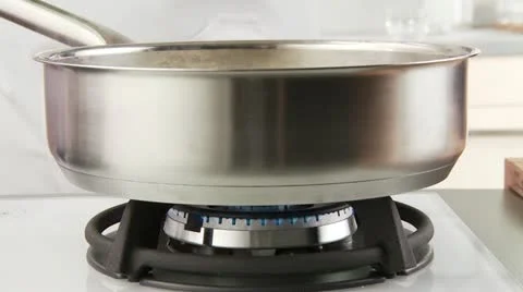 Cooked asparagus with a draining spoon being removed from the water Video stock 24646349