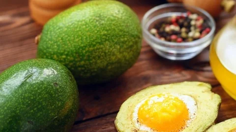 Cooked avocado with egg, pepper and salt Video stock 71348312