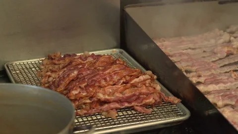 Cooked bacon next to raw bacon Video stock 73882788