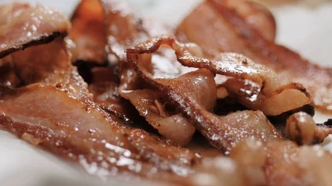 Cooked bacon slice placed on top of others Video stock 102569630