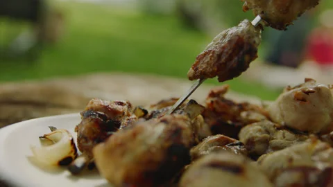 Cooked Bbq Meat Taking Down from Skewer on Plate Stock Footage 144797646