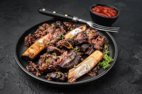 Cooked beef ribs slow cooked until tender with pulled meat and bones. BBQ s.. Stock Photos