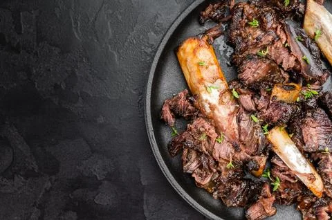 Cooked beef ribs slow cooked until tender with pulled meat and bones. BBQ s.. Stock Photos