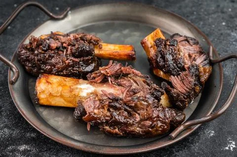 Cooked beef ribs slow cooked until tender with bone and sauce. BBQ style be.. Stock Photos