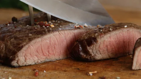 Cooked beef steak medium rare cut with a knife Stock Footage 89853948
