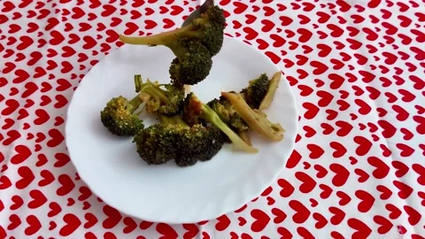Cooked Broccoli on White Plate Over Heart - Patterned Tablecloth Scene 스톡 동영상 327520124