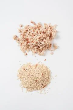 Cooked brown rice on white table Stock Photos
