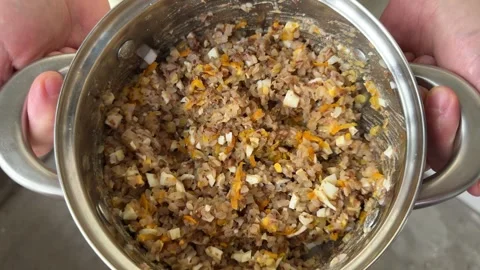 Cooked buckwheat mixed with chopped egg and vegetables  Video stock 346515887