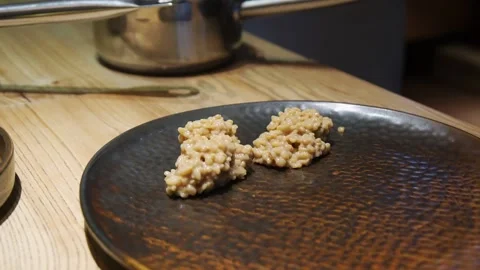 Cooked bulgur on brown ceramic plate on the table. Selective focus. Stock Footage 203580036
