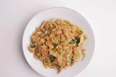 Cooked cabbage with herbs on a white plate Stock Photos