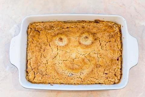 Cooked cake with a smile Stock Photos
