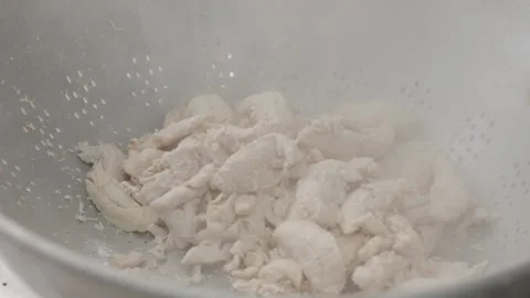 COOKED CHICKEN BEING DUMPED INTO A COIN Stock Footage 289513696