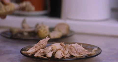 Cooked chicken meat being removed from the bone Stock Footage 87861313