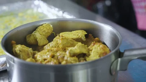 Cooked chicken over the tabletop and steam shows it's warm Stock Footage 129993425