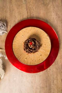 Cooked chocolate pasta spaghetti with raspberry sauce Stock Photos