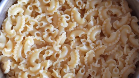 Cooked creste di gallo pasta served in a metal pot Stock Footage 332638337