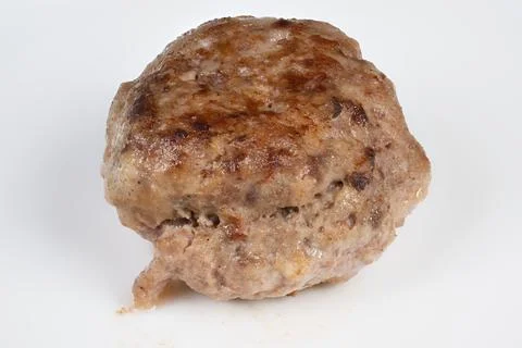Cooked cutlet on white background. Image of seared cutlet with crust and mo.. 写真素材