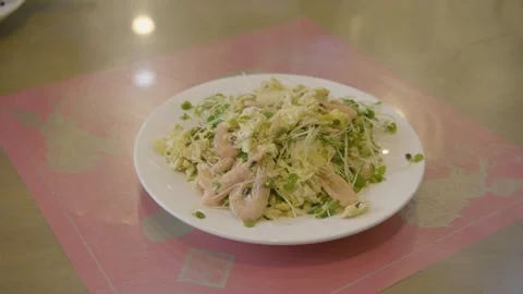 Cooked Egg and Shrimp Dish with Sprouts Served on Plate in Beijing Restaurant Stock Footage 345788820