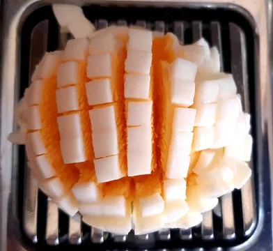 Cooked egg cut into small pieces. Stock Photos