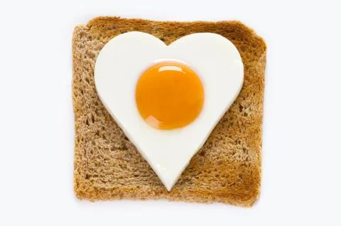 Cooked egg on toast Stock Photos