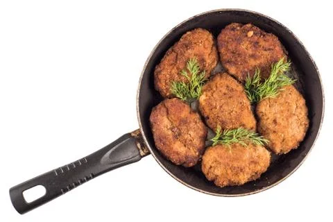 Cooked fried cutlets in pan isolated on white background, top view Stock Photos