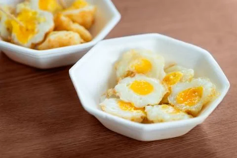 Cooked fried quail eggs Stock Photos