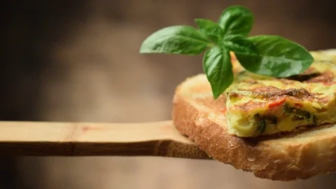 Cooked frittata with zucchini on slice of bread Stock Footage 114899788