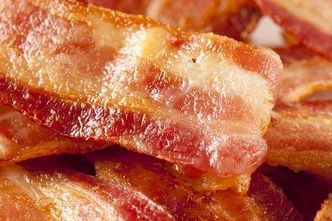 Cooked Greasy Bacon Stock Photos