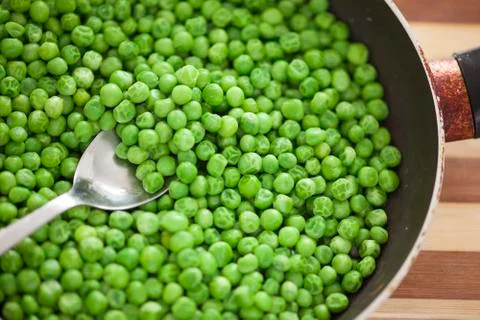 Cooked green peas Stock Photos