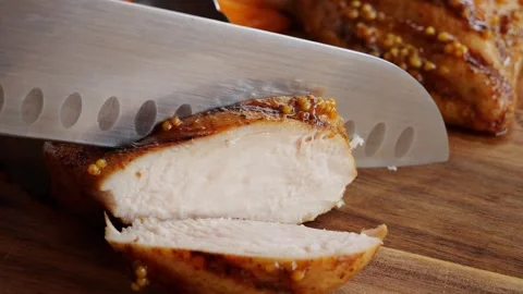 Cooked on grill chicken breast cut into slices with a knife, close up. Vídeos de archivo 247667481