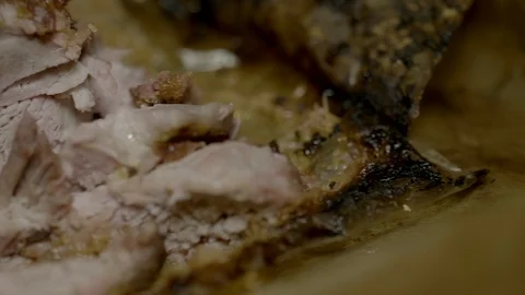 Cooked hog roast pulled pork on a large metal serving tray close up 4K Stock Footage 86413262