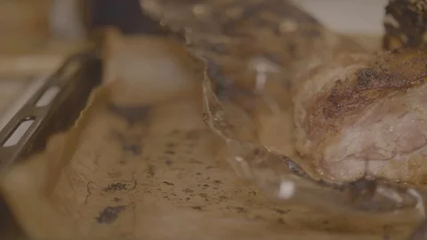 Cooked hog roast pulled pork on a large metal serving tray close up 4K Stock Footage 86435104