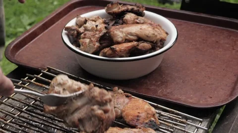 The cooked kebab is put in a bowl,   Stock Footage 275571509
