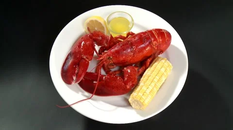 Cooked lobster with corn on the cob and butter sauce Stock Footage 8570828