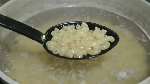 Cooked Macaroni Pasta in a Spoon Over Boiling Water Stock Footage 320030250