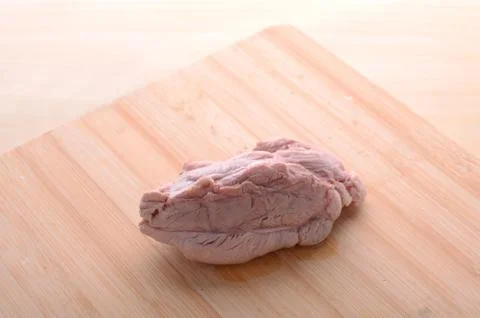 Cooked meat on chopping board Stock Photos