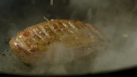 Cooked meat, a lot of steam Stock Footage 151274092