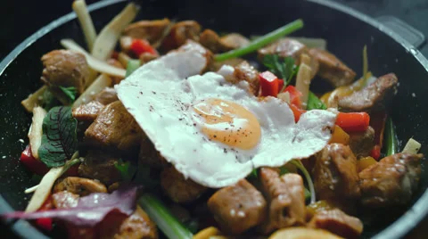 Cooked meat meal with vegetables, egg in a pan Stock Footage 58337761