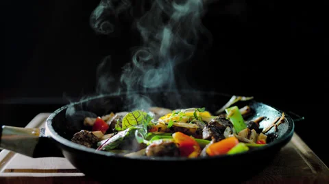 Cooked meat meal with vegetables in a pan Stock Footage 58499987