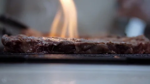 Cooked meat on an open fire Stock Footage 124364794