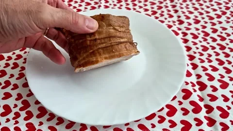 Cooked Meat on White Plate with Red Heart Pattern Tablecloth Background Stock Footage 333894586