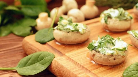 Cooked mushrooms stuffed with spinach and cheese Video stock 71350253